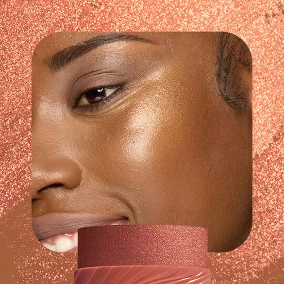 Model with deep copper-gold highlight wearing NYX Buttermelt Stix in Left On Melt 13 showing rich radiant finish