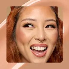 Close-up of model wearing Wonder Snatch(TM) Concealer in Shade 13 Medium Light.