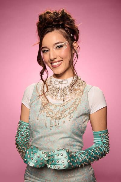 Mummy-inspired Halloween makeup look, with stretched out pink mouth look and a smokey eye