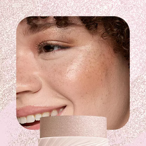 Model wearing NYX Buttermelt Stix in That's So Melt 03 showing icy white cool-tone glow on cheekbone