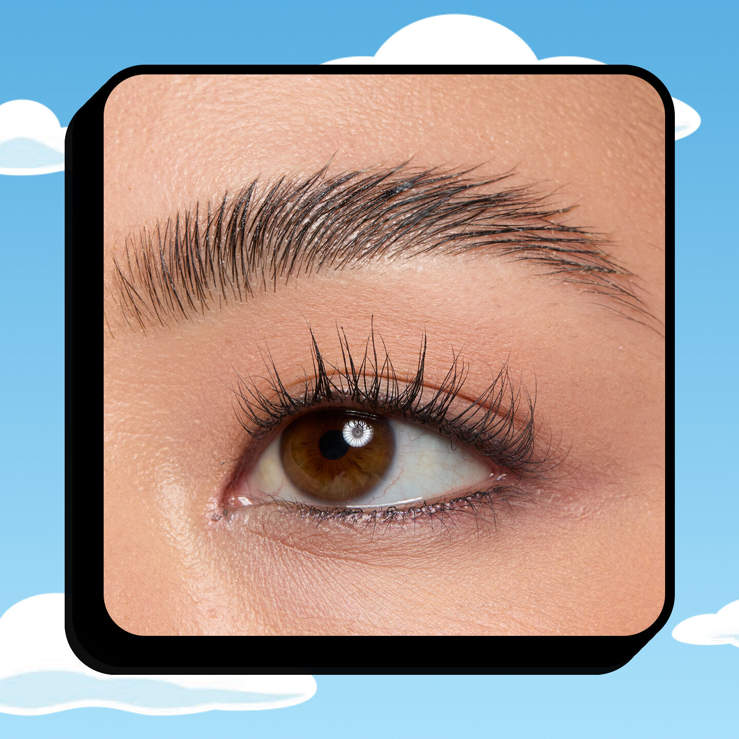 Macro of NYX Professional Makeup 2 in 1 Brow and Hair Styler Glue on blue sky, white cloud background.