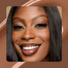Close-up of model wearing Wonder Snatch(TM) Concealer in Shade 25 Mocha.
