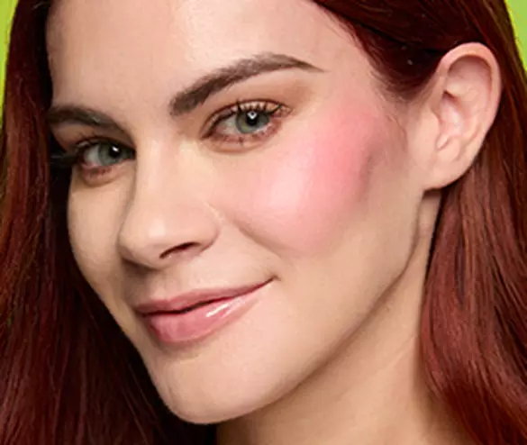 Closeup of woman wearing Fat Cheeks Juicy Blush in both shade Guava Gush and shade Papaya Plump