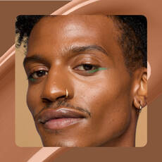 Close-up of model wearing Wonder Snatch(TM) Concealer in Shade 23 Sienna.