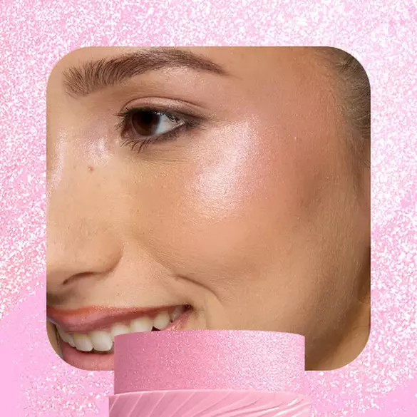 Model with radiant pink highlight wearing NYX Buttermelt Stix in My Melt Era 04 showing luminous shimmer finish