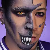 NYX Professional Makeup purple skull Halloween look with violet face paint, dark smoky eyes and white painted teeth.