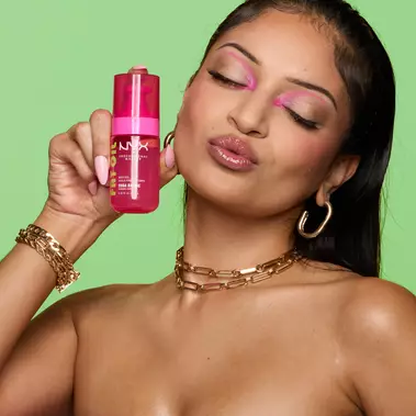 model holding fat oil body oil