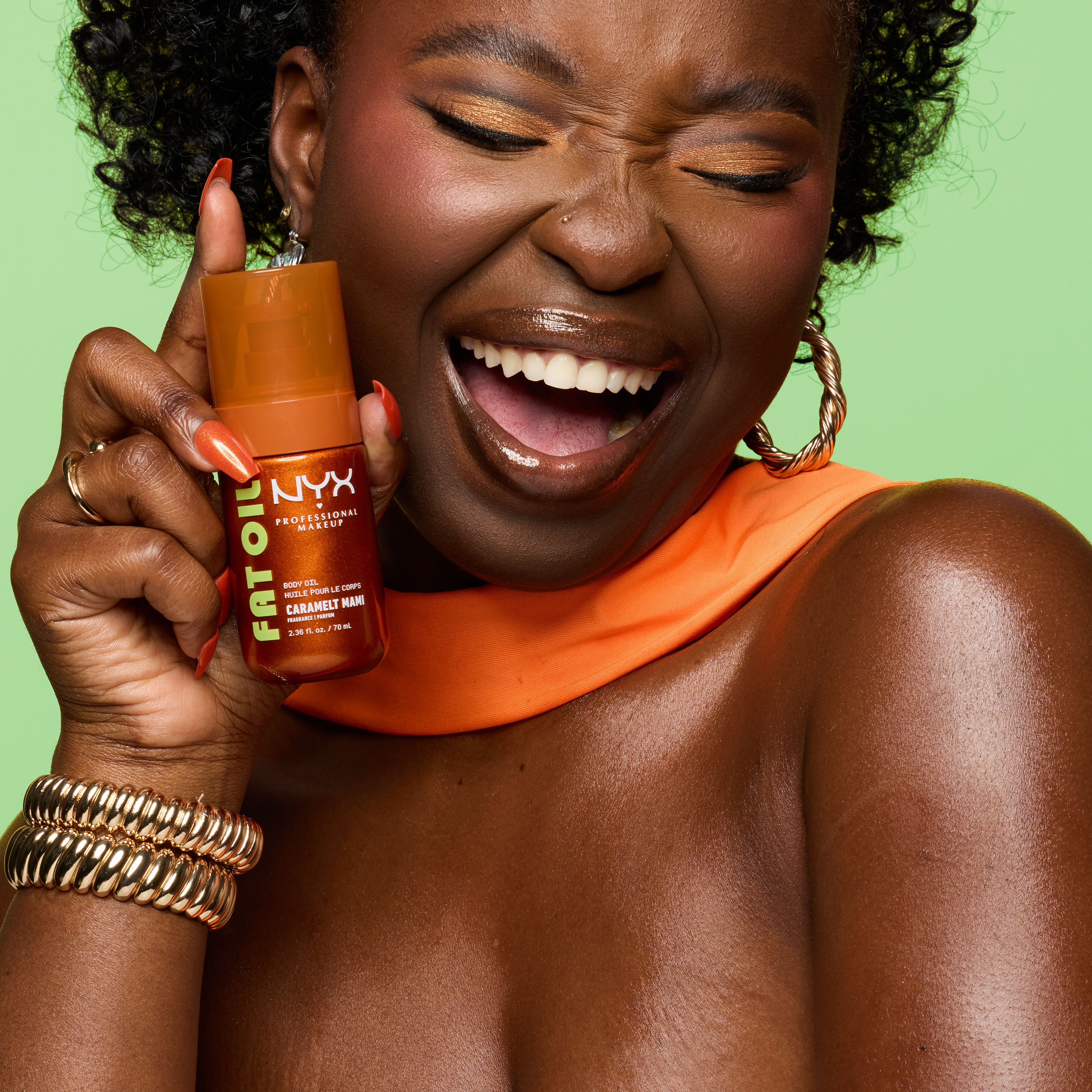 model holding fat oil body oil