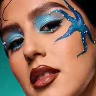 NYX Professional Makeup Halloween look with blue Star eye makeup, and blue eyeshadow